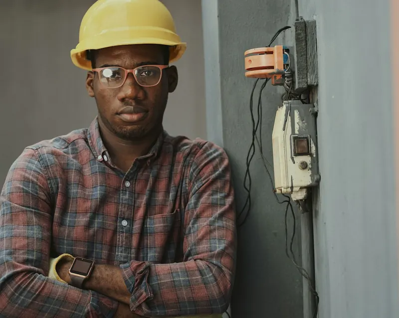 Home services electrician at a residential electrical panel