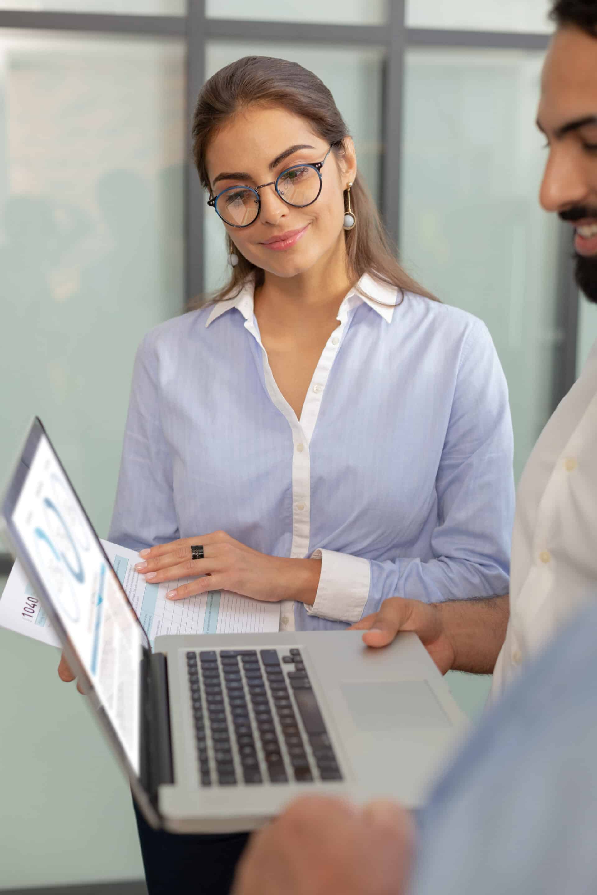 Pleased Office Workers Staring At Screen Of Laptop Click4Corp’s Common Mistakes To Avoid When Hiring An Seo Consultant In Plano Tx