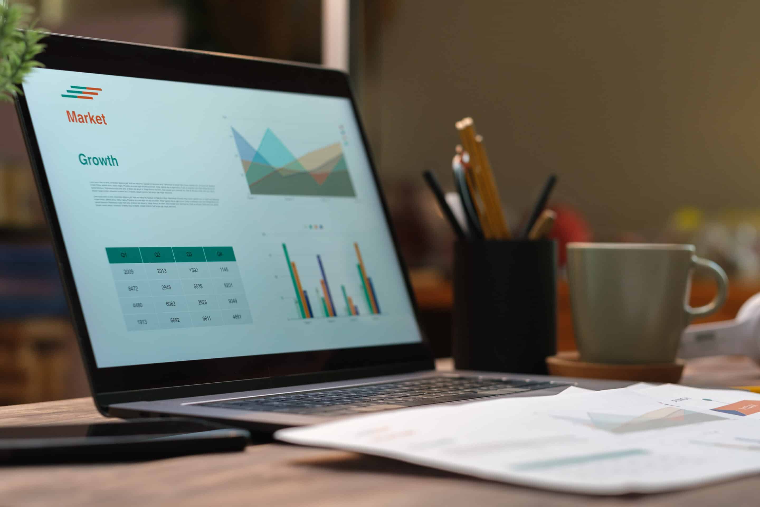 Laptop With Paperwork On Wood Table In Living Room 2024 12 05 14 11 47 Utc Scaled